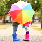 kid holding umbrella